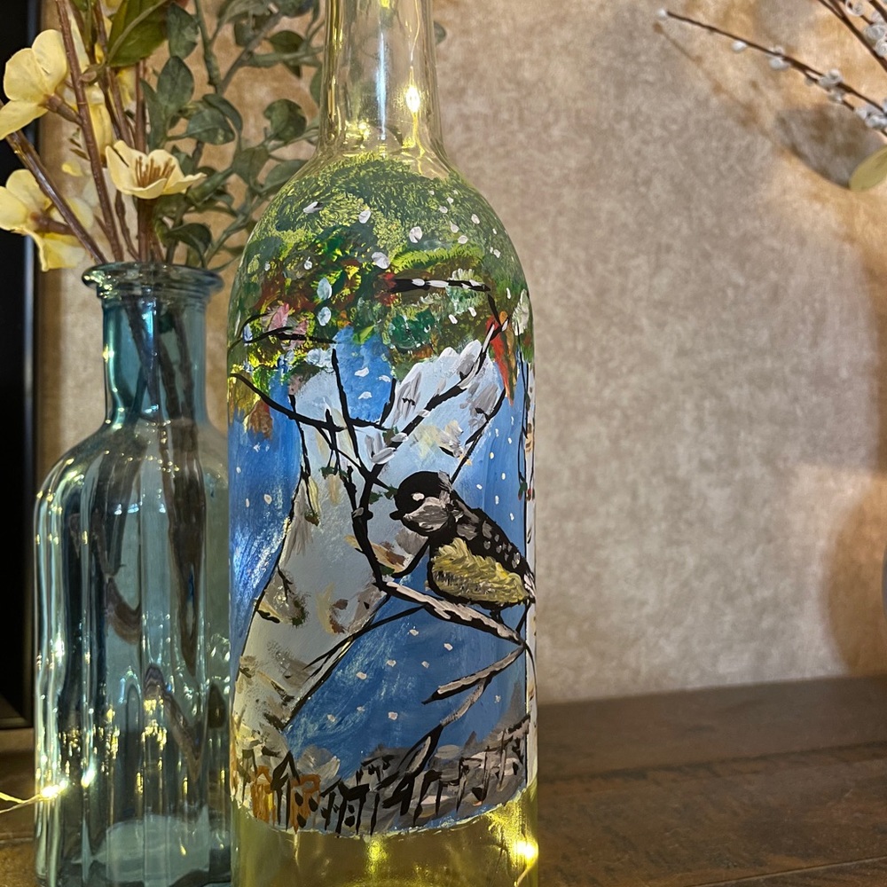 Painted wine bottle bird with fairy lights!